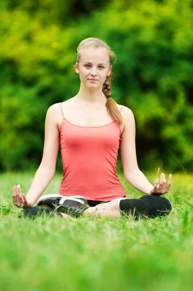 Young woman doing stretching exercise Stock Picture