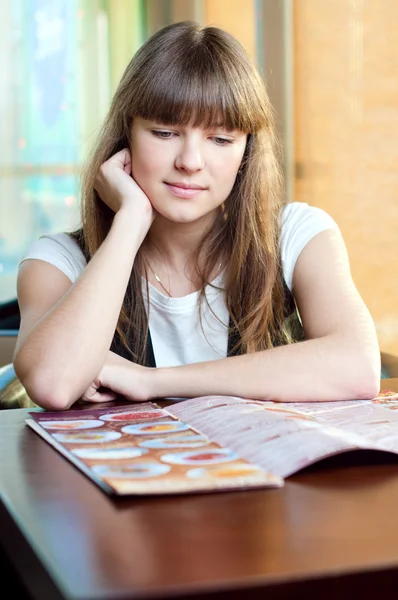 A young woman in a cafe Royalty Free Stock Photos