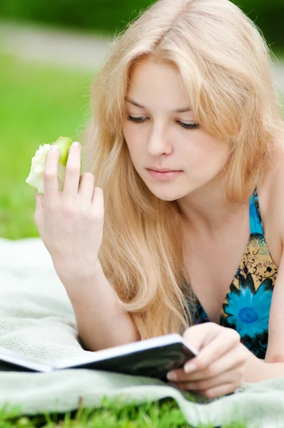Beautiful young woman read book Stock Image