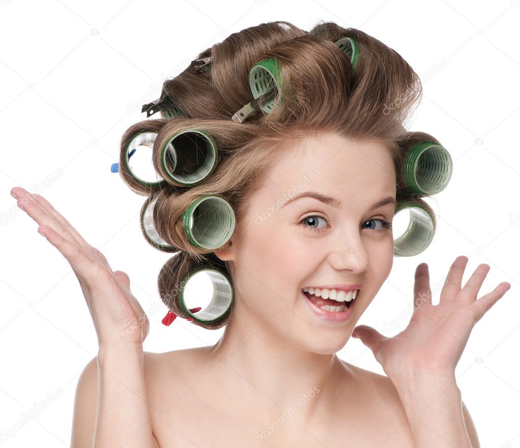 Woman curling her hair with roller