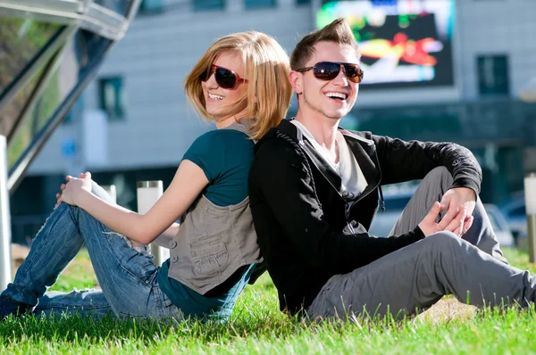 Happy teenage couple playing outdoor — Stock Photo, Image