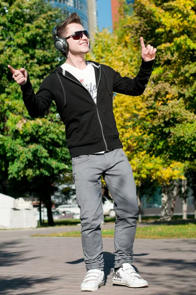 stock image Casual man dancing in city park