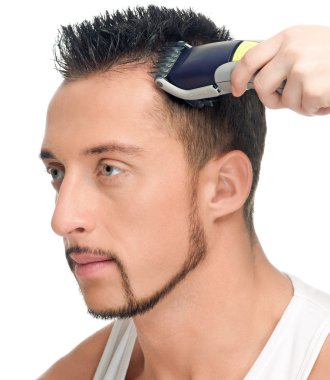 Cutting hairs of attractive man clipart