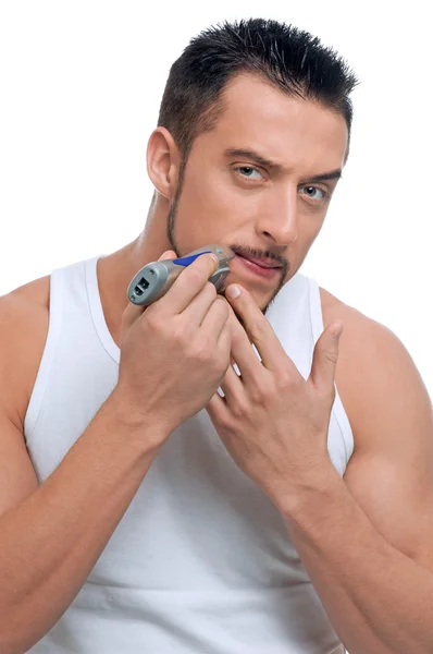 Young handsome man shaving — Stock Photo, Image