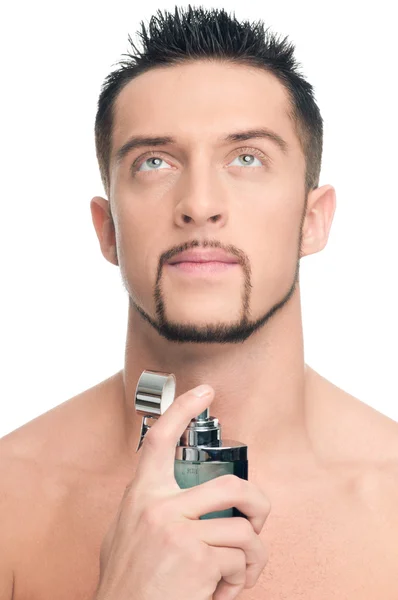 Young handsome man applying perfume — Stock Photo, Image