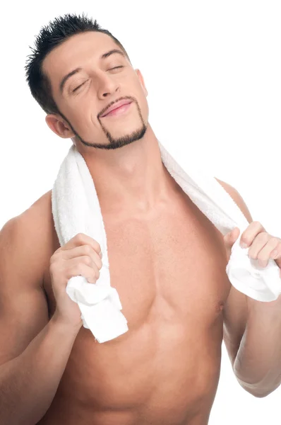 Young man with white towel. SPA. Isolated. — Stock Photo, Image