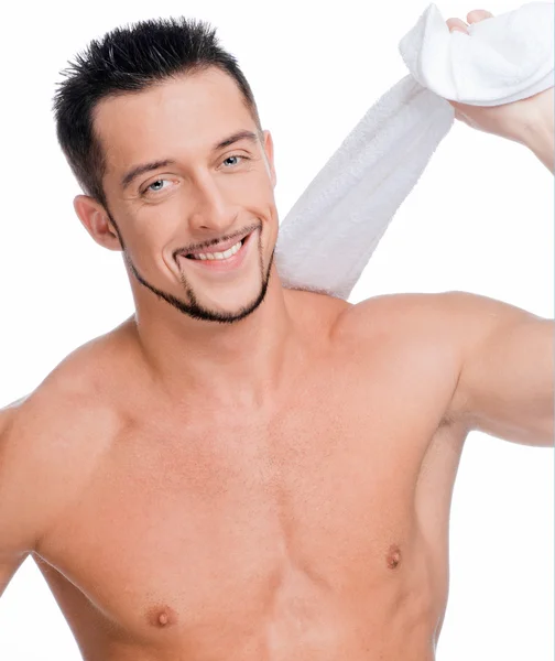 Junger Mann mit weißem Handtuch. Wellness. isoliert. — Stockfoto