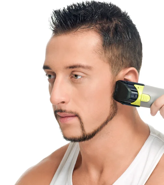 Cutting hairs of attractive man — Stock Photo, Image
