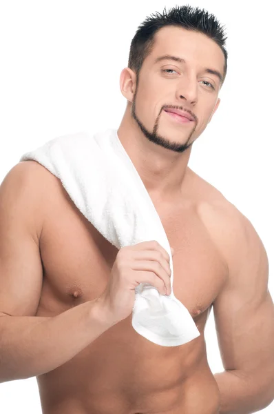 Νεαρός άνδρας με λευκή πετσέτα. σπα. απομονωμένη. — Φωτογραφία Αρχείου
