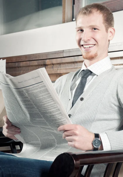 Sure young business man with newspaper — Stock Photo, Image