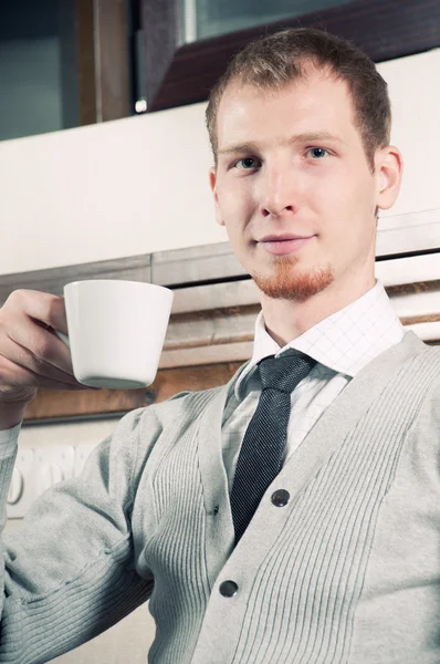 Sure young business man with coffee — Stock Photo, Image
