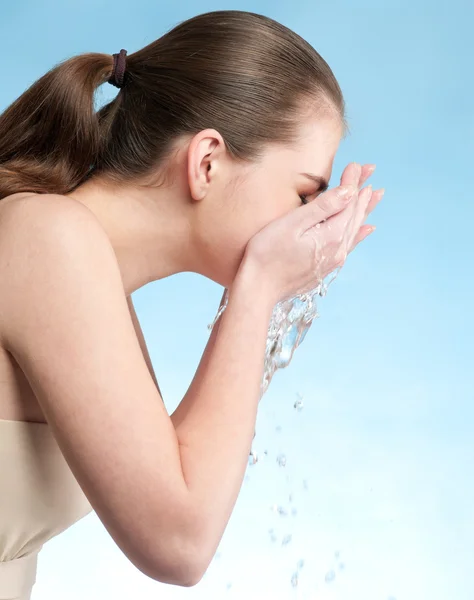 Stock image Portrait of beautiful emotional woman washing face