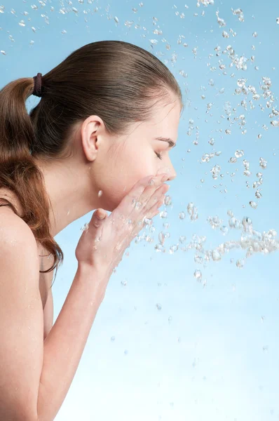 Portrait of beautiful emotional woman washing face — Stock Photo, Image