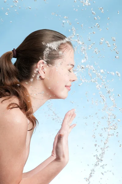 Portrait of beautiful emotional woman washing face — Stock Photo, Image