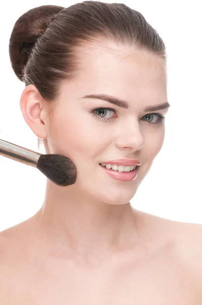 Beautiful young woman applying brush — Stock Photo, Image