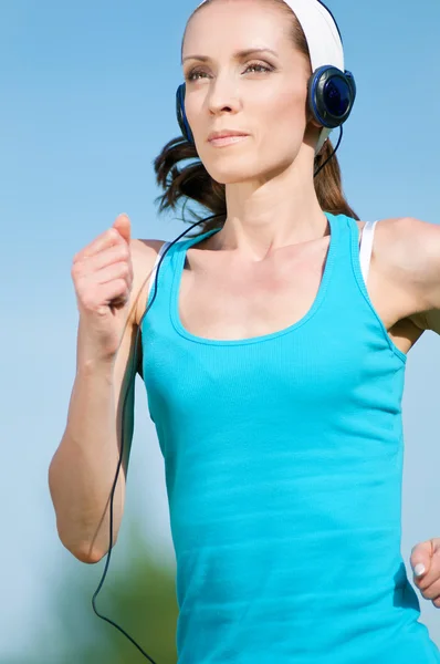 stock image Beautiful woman running in green park