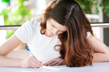 A young attractive woman sitting in a cafe with clipart