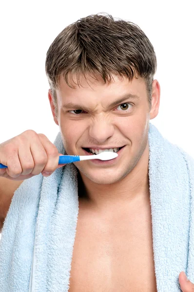 Ung man borsta tänderna — Stockfoto