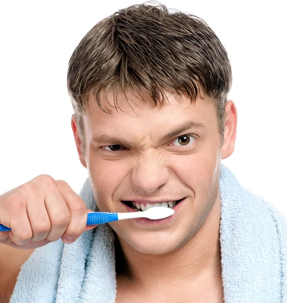 Ung man borsta tänderna — Stockfoto