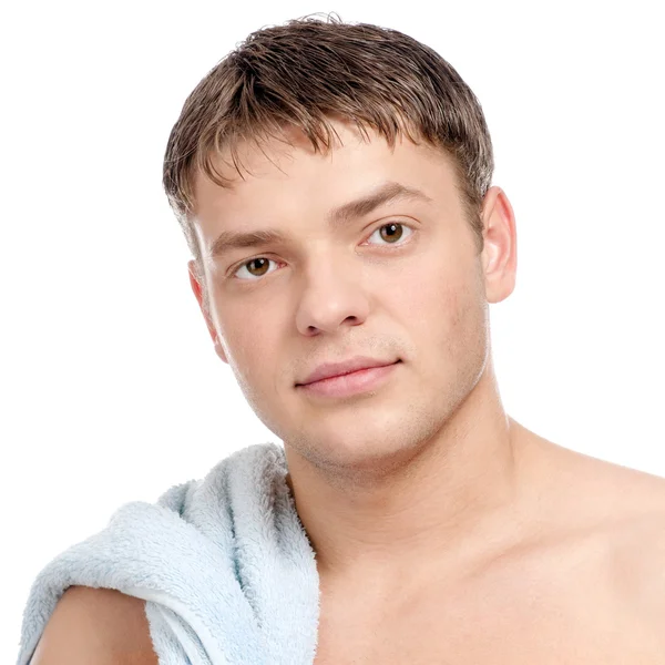 Um jovem com uma toalha — Fotografia de Stock