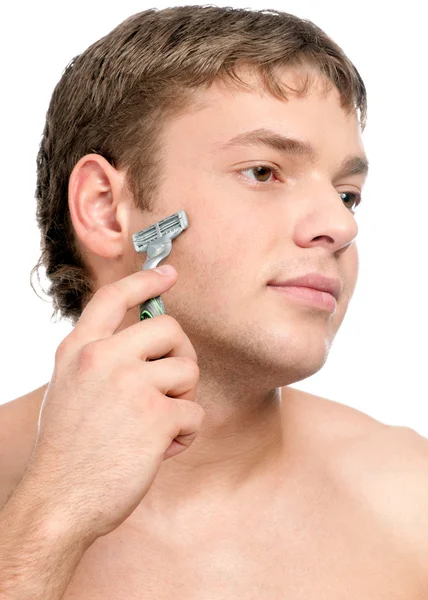 Portret van een jonge knappe man scheren — Stockfoto