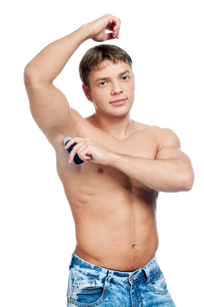 Muscular man's using an antiperspirant — Stock Photo, Image