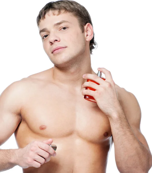 Cosmetic wellness man spraying fragrance — Stock Photo, Image