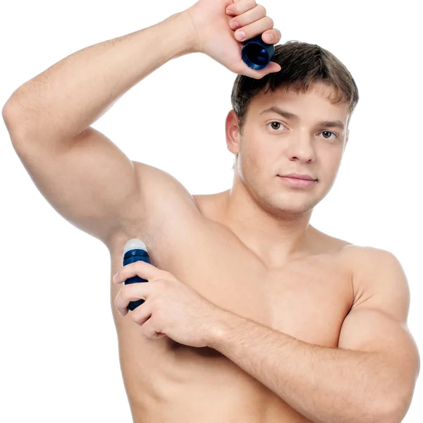 근육 질 남자는 발한 억제제의 사용 — 스톡 사진