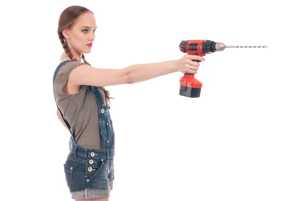 stock image Young woman holding drill with auger