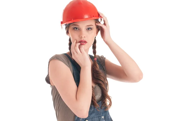Jonge speelse werknemers vrouw in overall en helm — Stockfoto