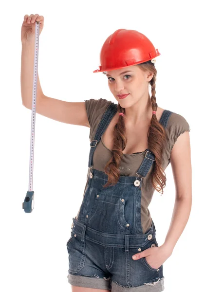 Young playful worker woman holding tape measure — Stock Photo, Image
