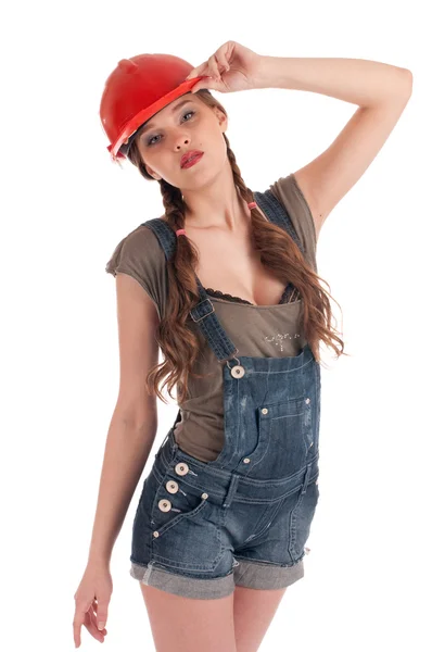 Giovane lavoratrice giocherellona in tuta e casco — Foto Stock