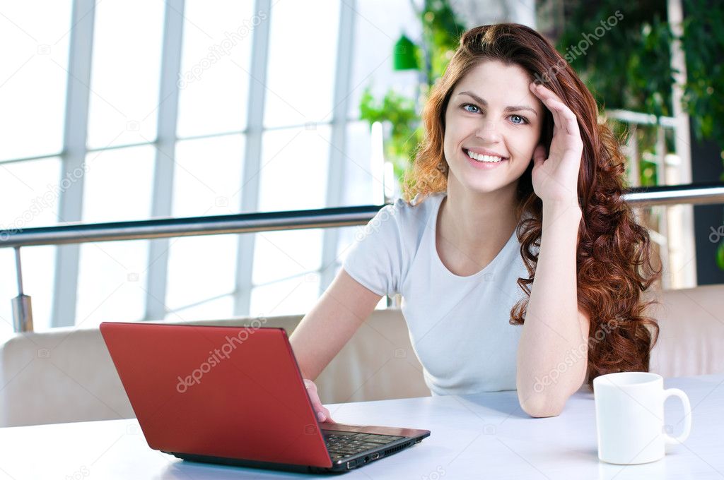 A young business woman sitting in a cafe
