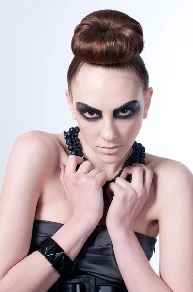 Beautiful fashion model with black make-up — Stock Photo, Image