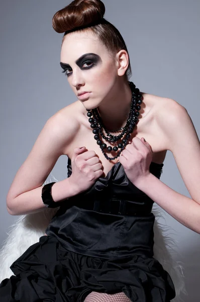 Beautiful fashion model with black make-up — Stock Photo, Image