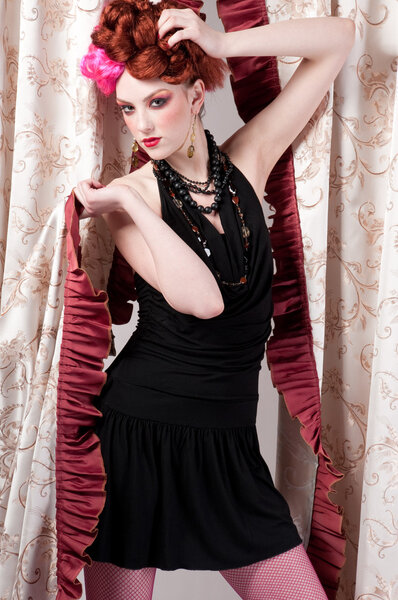 Closeup portrait of beautiful fashion woman posing with silck fabric.