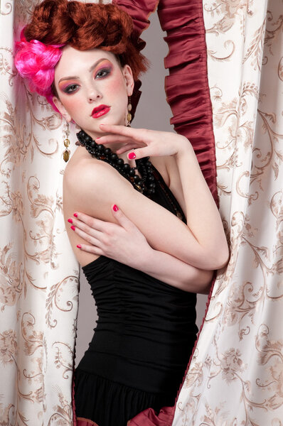 Closeup portrait of beautiful fashion woman posing with silck fabric.