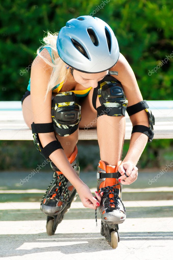 Young brunette woman on roller skates