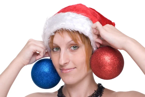 Close up portrait of girl in santa claus hat and decoration ball — Stock Photo, Image