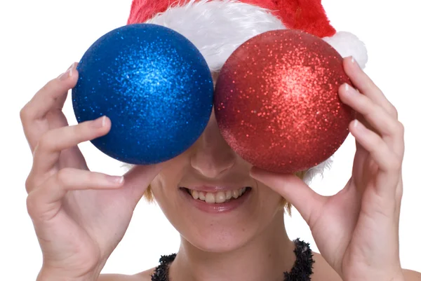 Close up portrait of girl in santa claus hat and decoration ball — Stock Photo, Image