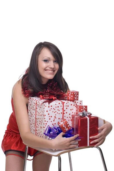 Close up retrato de menina em vestido de Papai Noel com presentes — Fotografia de Stock