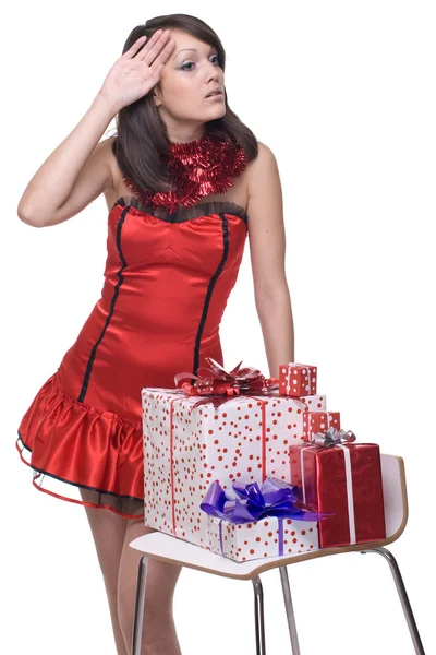 Portret dziewczynki w santa sukienka z darami z bliska — Zdjęcie stockowe