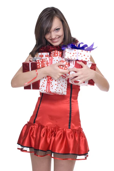 Vrouw in santa jurk met geschenken — Stockfoto