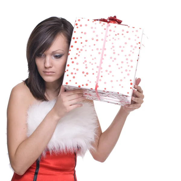 Жінка в сукні Санта з подарунками — стокове фото