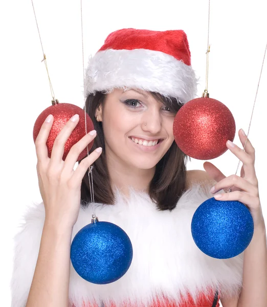 Frau im Weihnachtsmann-Kleid und Dekorationskugeln — Stockfoto