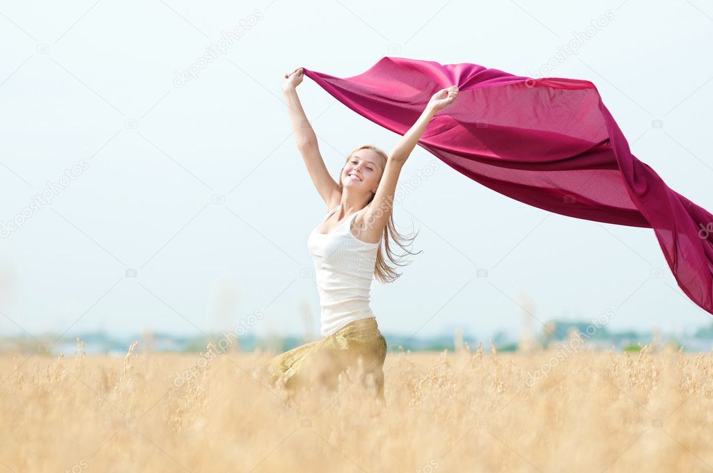 Happy woman on picnic in wheat field