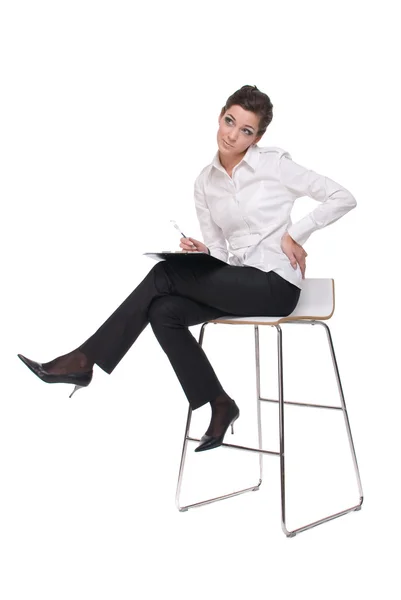 Portrait of young emotional business woman on chair — Stock Photo, Image