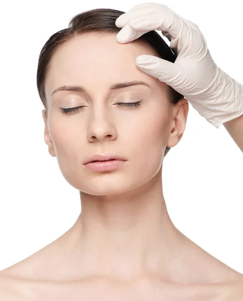 Beautician touch and exam health woman face. — Stock Photo, Image