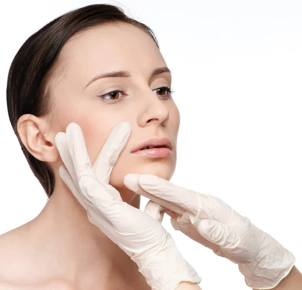 Beautician touch and exam health woman face. — Stock Photo, Image