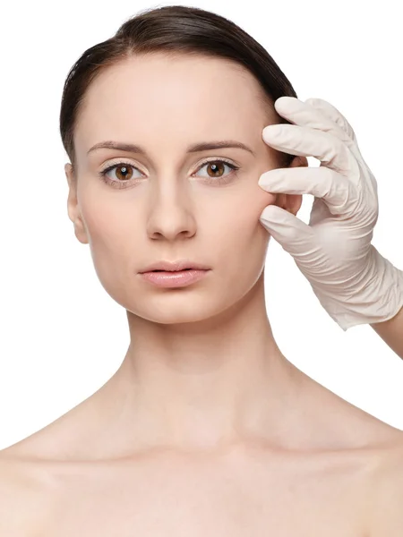 Beautician touch and exam health woman face. — Stock Photo, Image